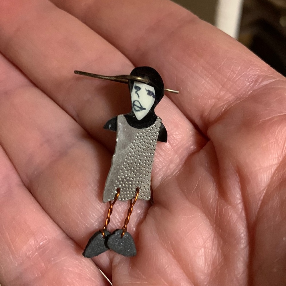 - One earring… cool piece. Purchased at contemporary art museum in Chicago.